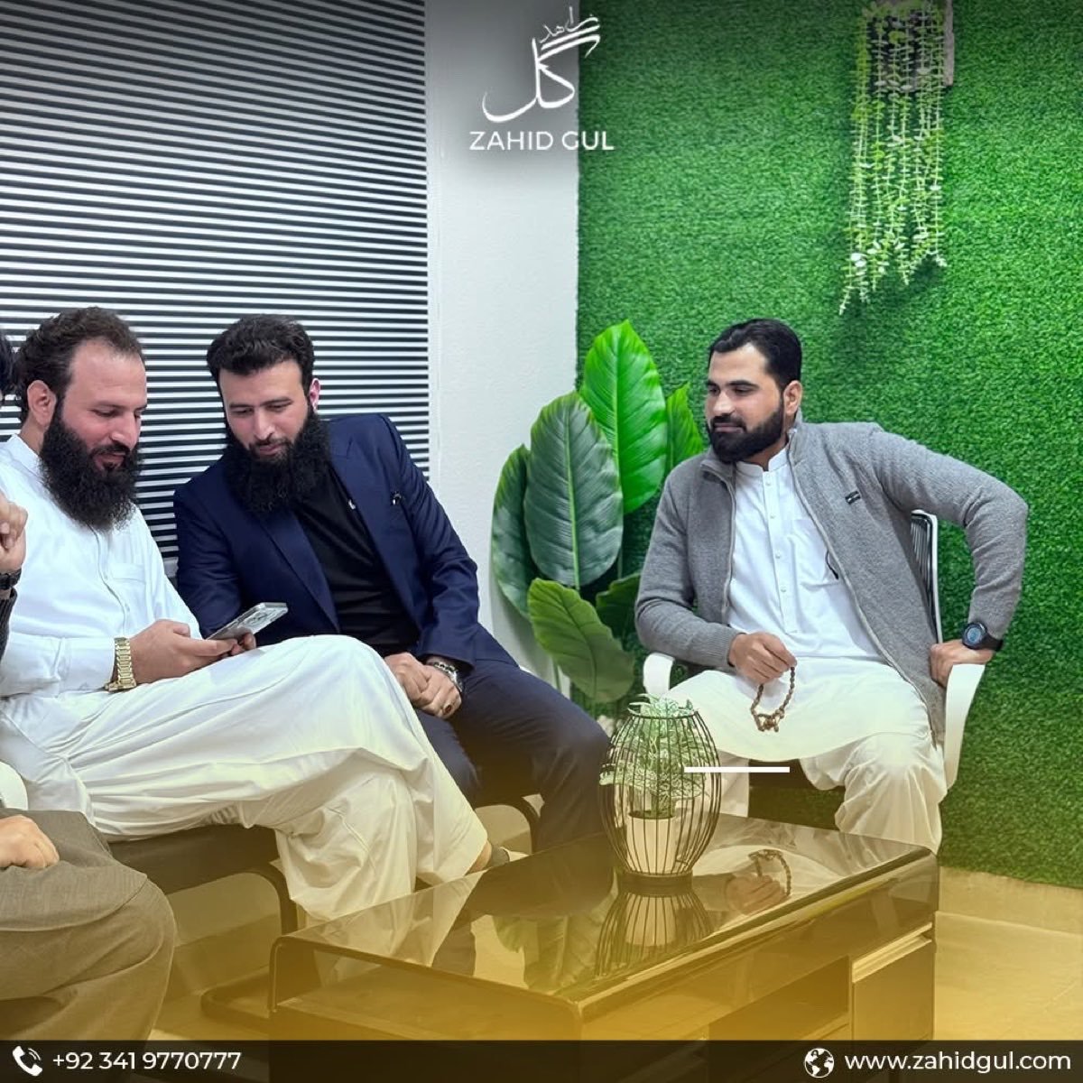 Zahid Gul meeting with colleagues at the Gul Heights office